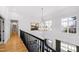 Upstairs view of foyer and two-story entry with elegant chandelier at 1012 Casa Dega Way, Raleigh, NC 27613