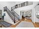 Grand foyer with high ceilings, staircase, hardwood floors, and views into the living spaces at 1012 Casa Dega Way, Raleigh, NC 27613