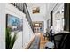 Welcoming foyer with staircase, wood floors, high ceilings, elegant decor, and views of dining room at 1012 Casa Dega Way, Raleigh, NC 27613