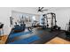 Well-equipped home gym with ample equipment, including a bike, weights, and open space at 1012 Casa Dega Way, Raleigh, NC 27613