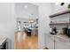 View of the open-concept kitchen with marble island and white cabinetry at 1012 Casa Dega Way, Raleigh, NC 27613