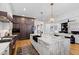 Open kitchen with a large island, modern appliances, and seamless flow into the living space at 1012 Casa Dega Way, Raleigh, NC 27613