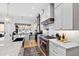 Gourmet kitchen with stainless steel appliances, granite countertops, and custom cabinetry at 1012 Casa Dega Way, Raleigh, NC 27613