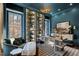 Home office with custom built-in shelving and a comfortable chaise lounge at 1012 Casa Dega Way, Raleigh, NC 27613