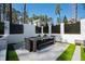Inviting outdoor dining area with modern seating and a peaceful setting at 1012 Casa Dega Way, Raleigh, NC 27613
