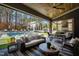 Inviting covered patio with comfortable seating, dining area, and view of the luxurious pool at 1012 Casa Dega Way, Raleigh, NC 27613