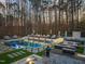Beautiful backyard oasis featuring a sparkling pool, comfortable lounge chairs, and a built-in grilling area at 1012 Casa Dega Way, Raleigh, NC 27613