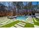 Serene pool area featuring a spa and ample lounge seating, ideal for outdoor living at 1012 Casa Dega Way, Raleigh, NC 27613