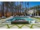Beautiful pool area with a jacuzzi and in-pool seating, perfect for outdoor relaxation at 1012 Casa Dega Way, Raleigh, NC 27613