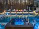 Serene pool view with a spa, tanning deck, and elegant waterfall features, creating a relaxing atmosphere at 1012 Casa Dega Way, Raleigh, NC 27613