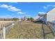 Expansive backyard with a wooden fence, offering privacy and a view of the surrounding landscape at 103 Fieldstone Dr, Clayton, NC 27520