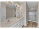 Bright bathroom showcasing double vanity, granite countertop, shower, and soaking tub for a spa-like experience at 103 Fieldstone Dr, Clayton, NC 27520