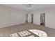 Spacious bedroom with neutral carpet, access to an ensuite bathroom, and a walk-in closet at 103 Fieldstone Dr, Clayton, NC 27520