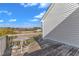 Outdoor deck with a small table, offering scenic views of the surrounding landscape for relaxing and entertaining at 103 Fieldstone Dr, Clayton, NC 27520