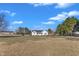 Wide shot of the front of a single story home surrounded by a large grassy lawn at 103 Fieldstone Dr, Clayton, NC 27520
