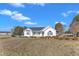 Charming single-story home featuring a covered front porch and trimmed landscaping at 103 Fieldstone Dr, Clayton, NC 27520