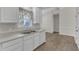 Open concept kitchen featuring modern appliances, generous counter space, and hardwood floors at 103 Fieldstone Dr, Clayton, NC 27520