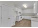 A bright kitchen with white cabinets, modern appliances, and durable flooring at 103 Fieldstone Dr, Clayton, NC 27520