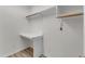 Well-lit laundry room featuring wooden-style flooring and a built-in counter at 103 Fieldstone Dr, Clayton, NC 27520