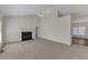 Neutral living room showcasing a fireplace, neutral carpeting, and an open layout leading to dining area at 103 Fieldstone Dr, Clayton, NC 27520