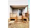 Back porch with stairs, sliding glass door and natural wood railing at 105 Cross Hill Ln, Holly Springs, NC 27540