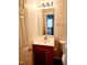 Bathroom includes a light fixture above the mirror and vanity with storage below at 105 Cross Hill Ln, Holly Springs, NC 27540