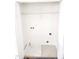Empty laundry room with hookups, overhead light, and tile flooring at 105 Cross Hill Ln, Holly Springs, NC 27540