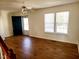 Living room features wood floors and a large double window at 105 Cross Hill Ln, Holly Springs, NC 27540