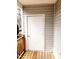 Side door of home with light gray siding and wooden porch at 105 Cross Hill Ln, Holly Springs, NC 27540