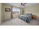 Bedroom featuring a large window, neutral walls, carpet floors, and a ceiling fan at 106 Jared Ct, Graham, NC 27253