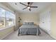 Bedroom featuring a large window, neutral walls, carpet floors, and a ceiling fan at 106 Jared Ct, Graham, NC 27253