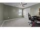 Bedroom featuring a desk, chair, carpet floors, neutral walls, fan, and window at 106 Jared Ct, Graham, NC 27253