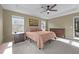 Bright bedroom featuring neutral walls, carpet floors, fan, and dark wood furnishings at 106 Jared Ct, Graham, NC 27253