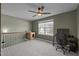 Bonus room with gray walls, fan, and large window allowing for ample natural light at 106 Jared Ct, Graham, NC 27253