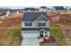 Aerial shot featuring a well-manicured front yard and two-car garage in this two-story home at 106 Jared Ct, Graham, NC 27253
