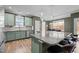 Stylish kitchen island with granite countertops, pendant lighting, and a view of the dining area at 106 Jared Ct, Graham, NC 27253