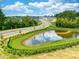 Aerial view of the community with pond, walking trails, and scenic landscaping at 112 Central Townes Way # 294, Raleigh, NC 27603