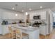 Bright kitchen with granite countertops, modern appliances, and breakfast bar at 112 Central Townes Way # 294, Raleigh, NC 27603