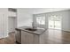 Bright, modern kitchen features a granite island, stainless steel dishwasher, and an open design for easy entertaining at 112 Central Townes Way # 294, Raleigh, NC 27603