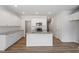 An eat-in kitchen featuring white cabinets, granite countertops, and stainless steel appliances at 112 Central Townes Way # 294, Raleigh, NC 27603