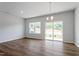 This spacious room features hardwood floors, recessed lighting, and access to a private back patio at 112 Central Townes Way # 294, Raleigh, NC 27603