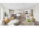 Open-concept living area featuring a kitchen with an island, a dining area, and comfortable seating at 112 Central Townes Way # 294, Raleigh, NC 27603