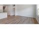 This bright room features hardwood floors, natural light and an open concept design with access to kitchen at 112 Central Townes Way # 294, Raleigh, NC 27603