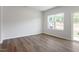 This bright room features hardwood floors, recessed lighting, and access to a private back patio at 112 Central Townes Way # 294, Raleigh, NC 27603