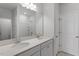 Bathroom featuring double vanity sinks with a large mirror and bright lighting at 116 Central Townes Way # 293, Raleigh, NC 27603