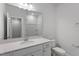 Bathroom featuring single sink vanity with a large mirror, toilet, and a shower-tub combination at 116 Central Townes Way # 293, Raleigh, NC 27603