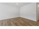 Bright, unfurnished bedroom with hardwood floors and neutral paint, awaiting your personal touch at 116 Central Townes Way # 293, Raleigh, NC 27603