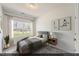 Cozy bedroom with neutral walls, carpet, and a sunny window with picturesque views at 116 Central Townes Way # 293, Raleigh, NC 27603