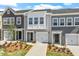 Charming townhomes with attached garages, professionally landscaped yards, and neutral color schemes at 116 Central Townes Way # 293, Raleigh, NC 27603