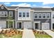Charming townhomes with attached garages, professionally landscaped yards, and neutral color schemes at 116 Central Townes Way # 293, Raleigh, NC 27603